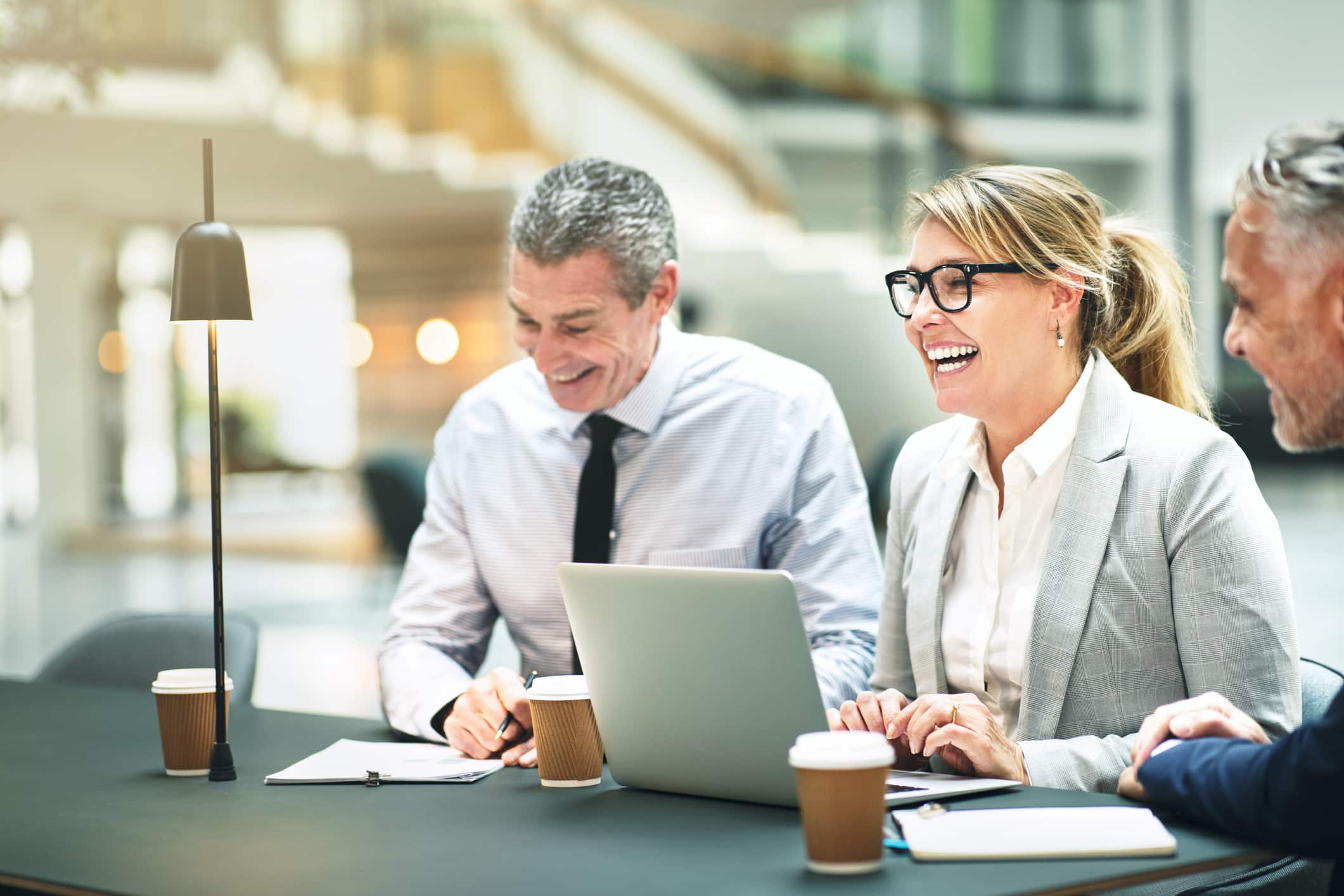 Business professionals reviewing documents together
